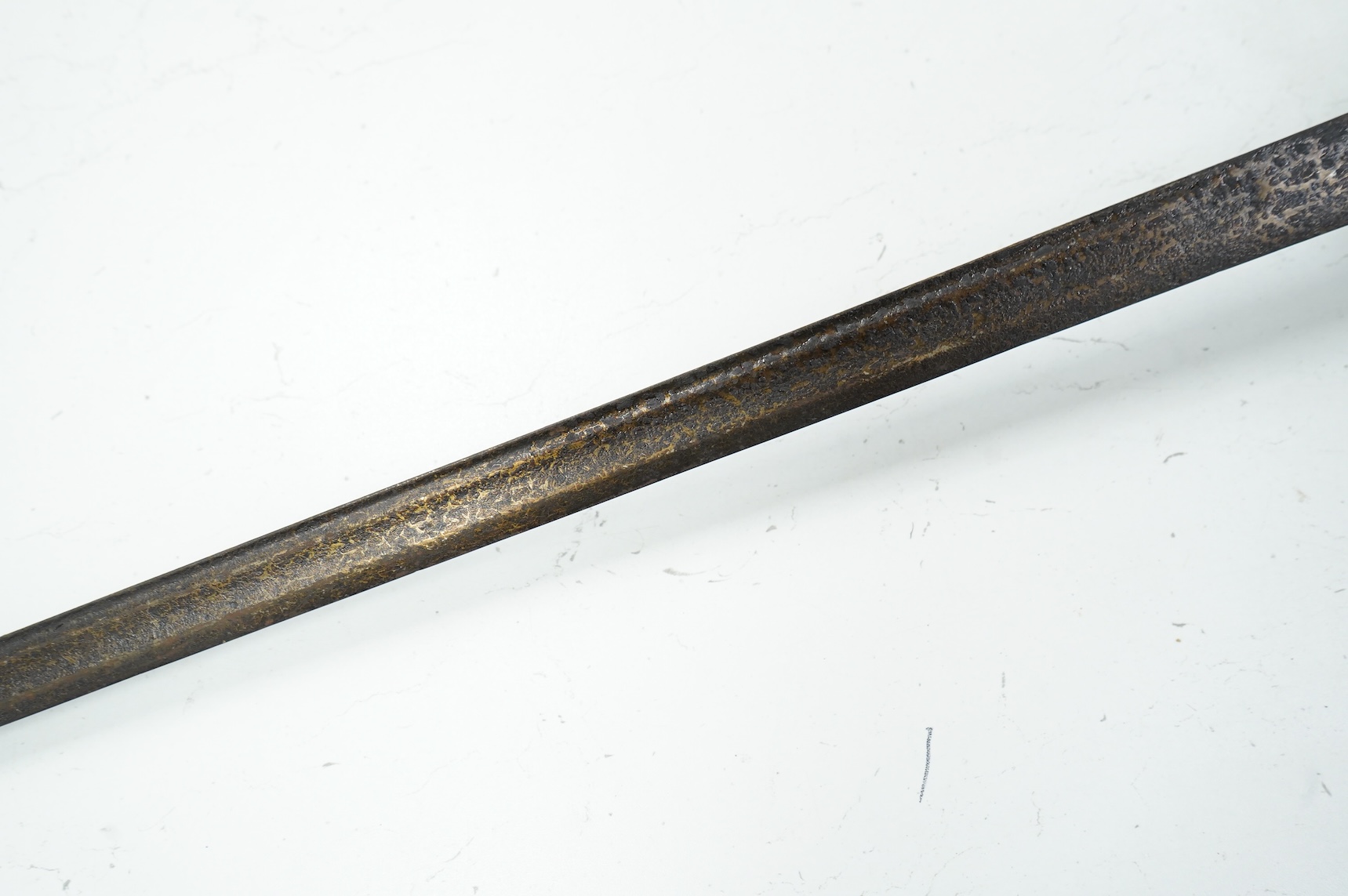 A basket hilted backsword of c.1750, with single edge blade cut with a pair of fullers, three-quarter basket guard comprising many rectangular openings, blade 90.5cm